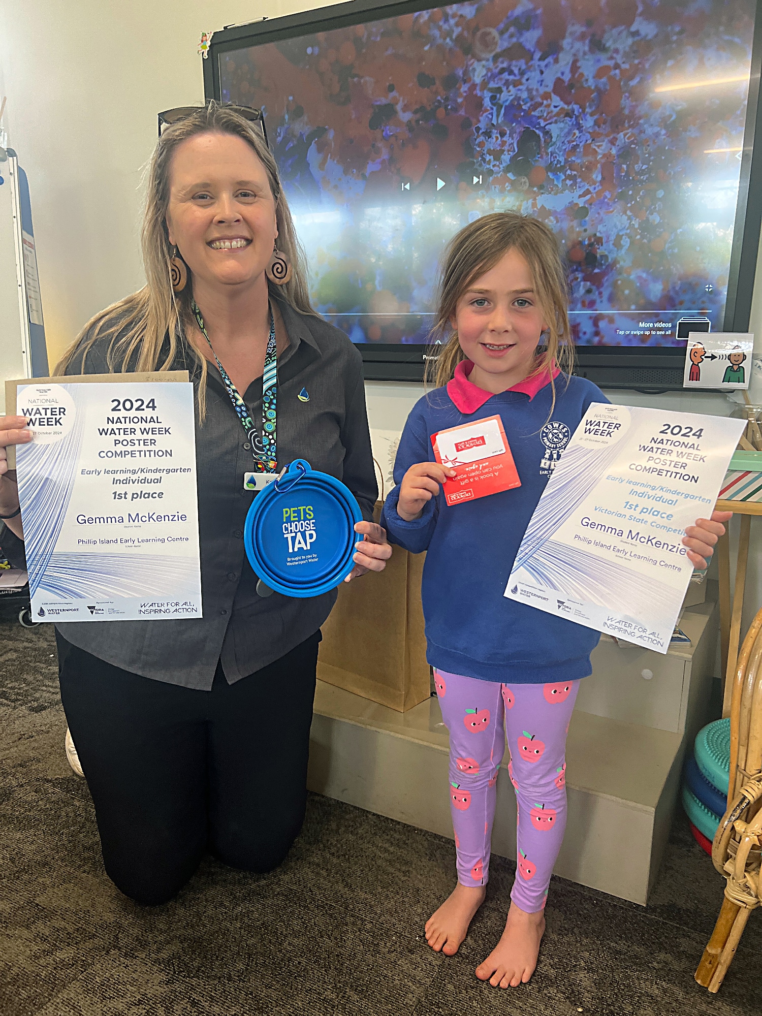 Katrina with Gemma from Phillip Island Early Learning Centre, winner of the best Kindergarten poster prize